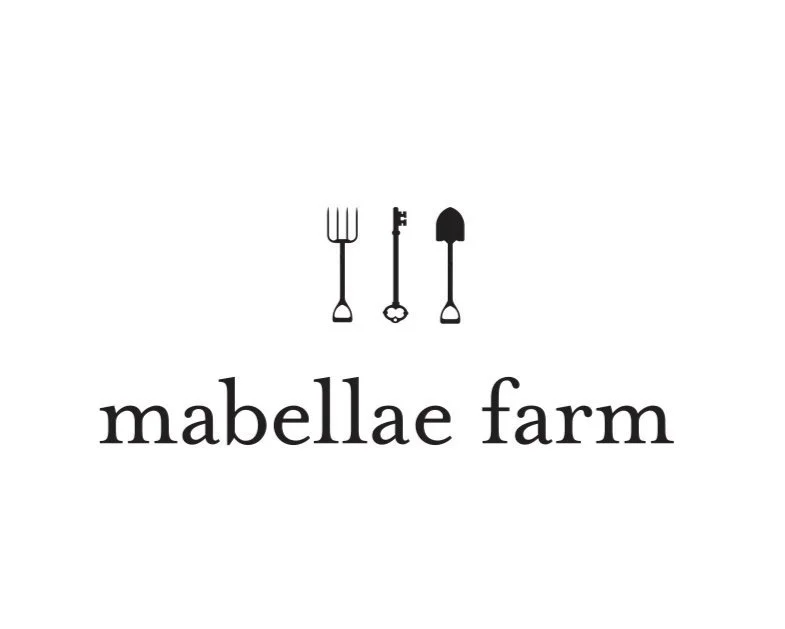 Logo for Mabellae Farm featuring stylized gardening tools and the farm name in lowercase letters.