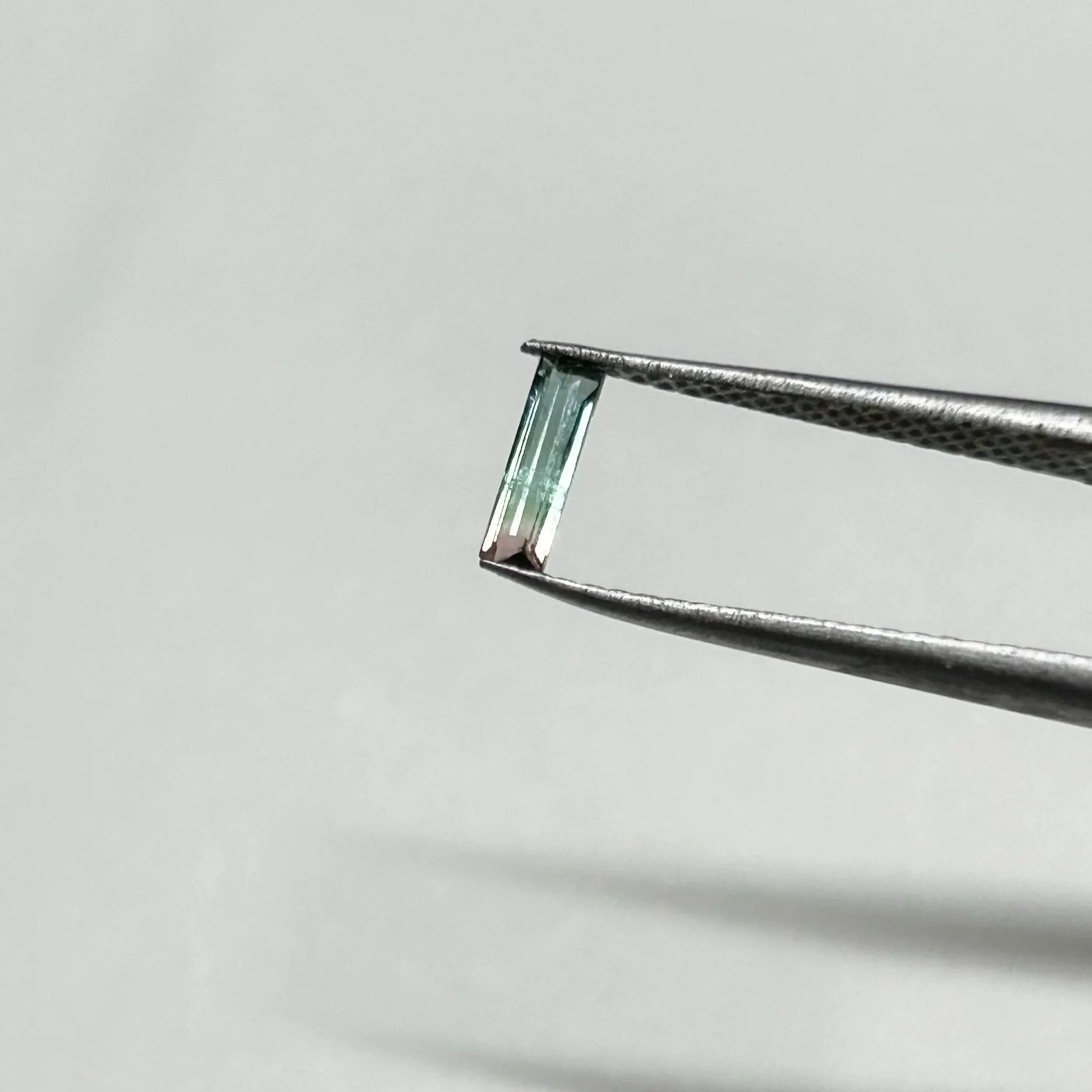 "T3" Bicolor green and pink tourmaline, $35, 2x7mm.