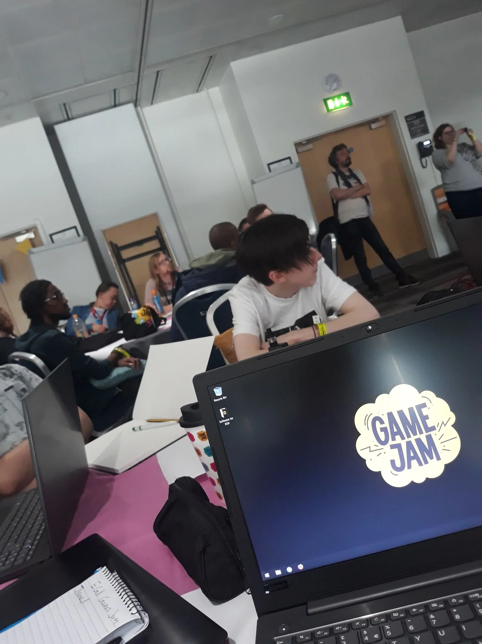 Listening to guest speakers before the theme reveal