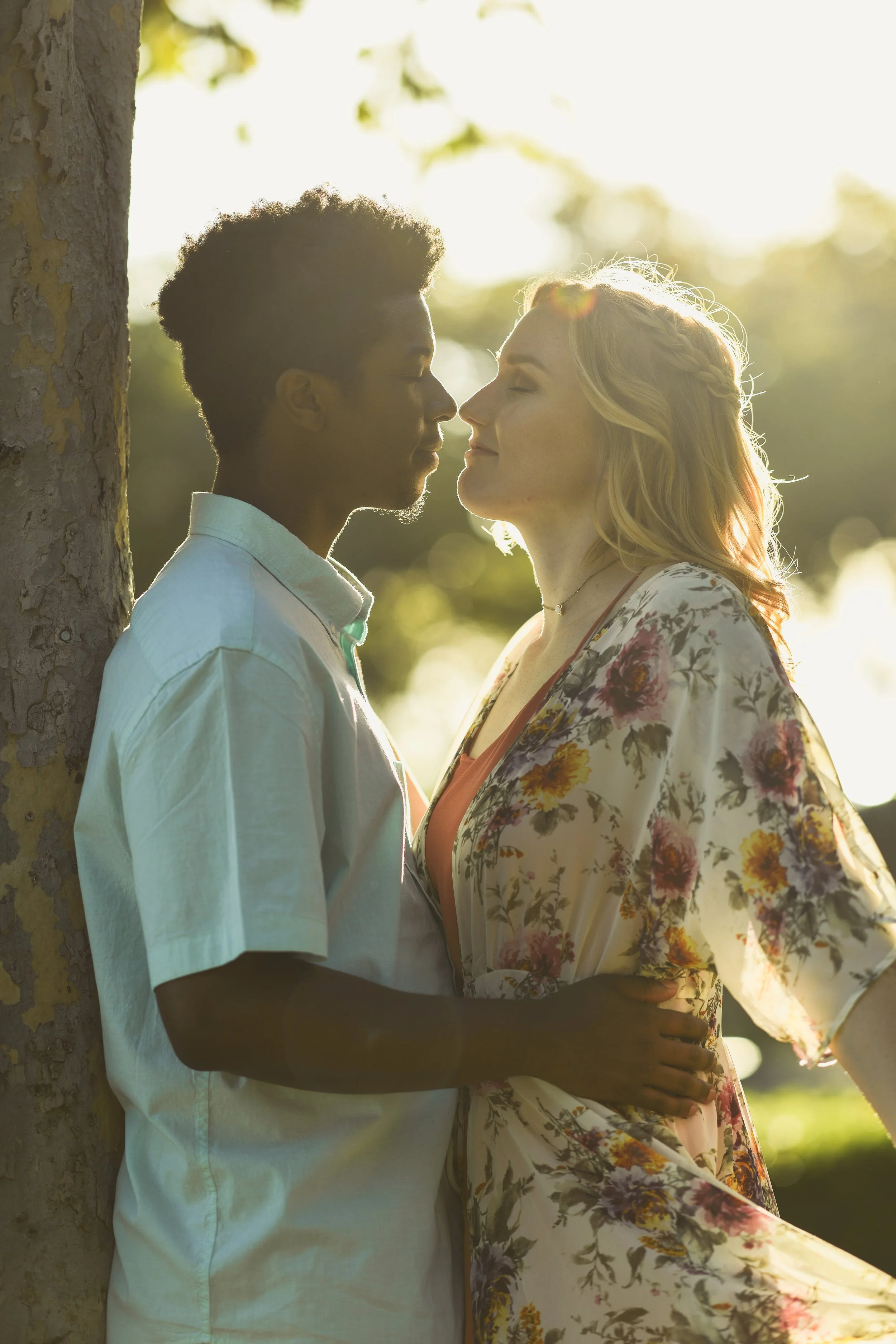 Candid couple leaning on tree in rancho Santa margarita during golden hour 