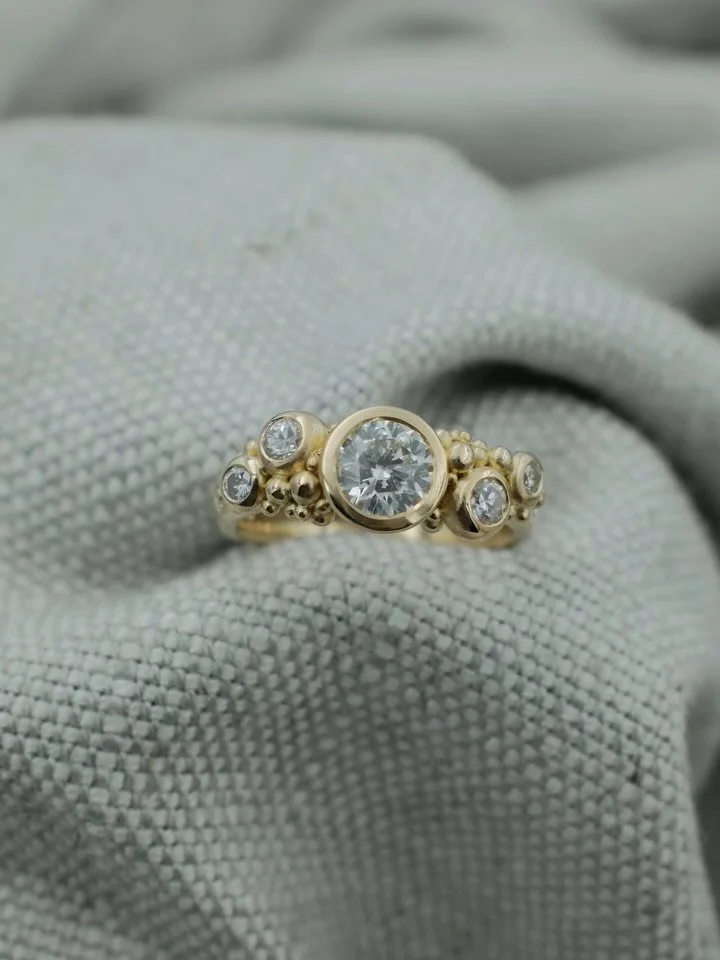 Bespoke Remodelling | Diamond Cluster Ring

A gorgeous remodel of a clients mother&rsquo;s diamond engagement ring and a collection of her loved, but no longer worn jewellery. Redesigned and brought to life in the this sparkling diamond cluster ring.