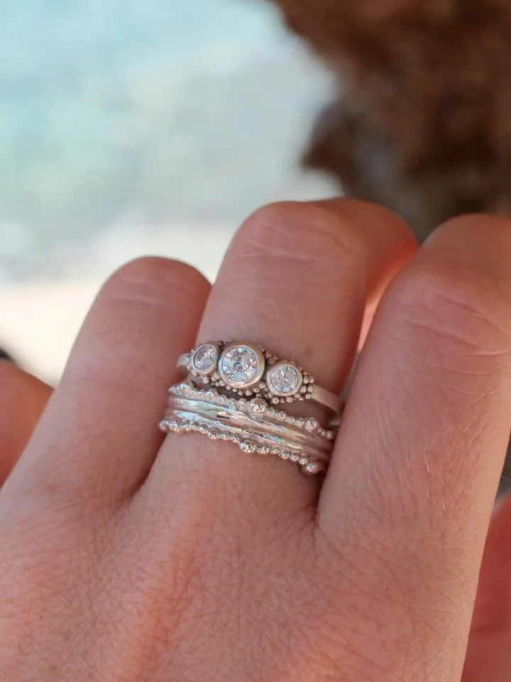 A gorgeous engagement ring set with a trio of sparkling white diamonds in platinum ✨. Paired with a platinum Granulated Duo ring as a wedding ring. A prefect pairing of texture, wonder and sparkle. 🩵.

LS. x

#bespokejeweller #engagementrings #weddi