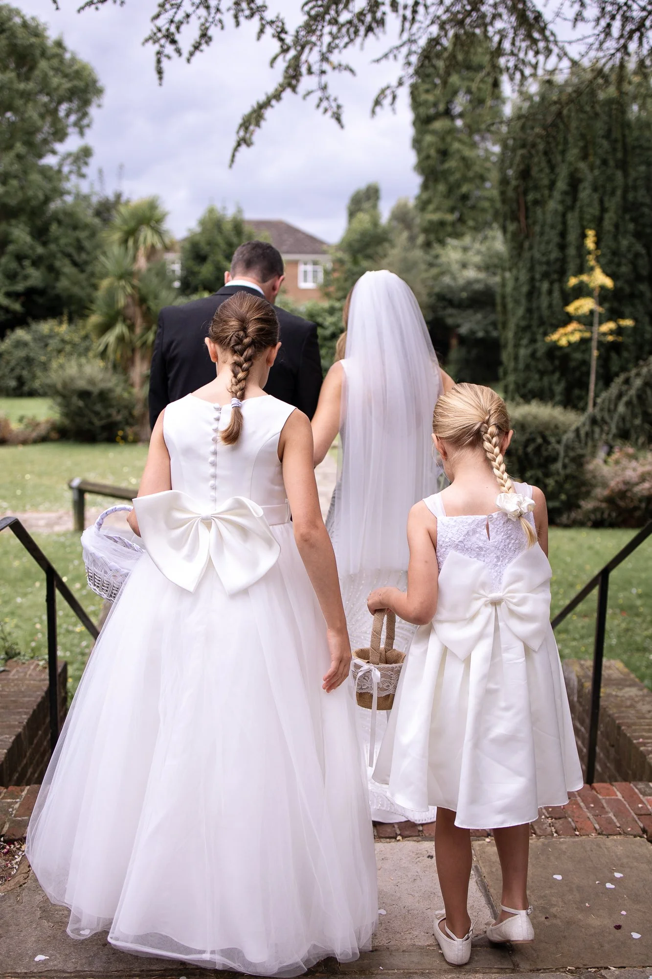Flower girls following a couple at Weybridge register office