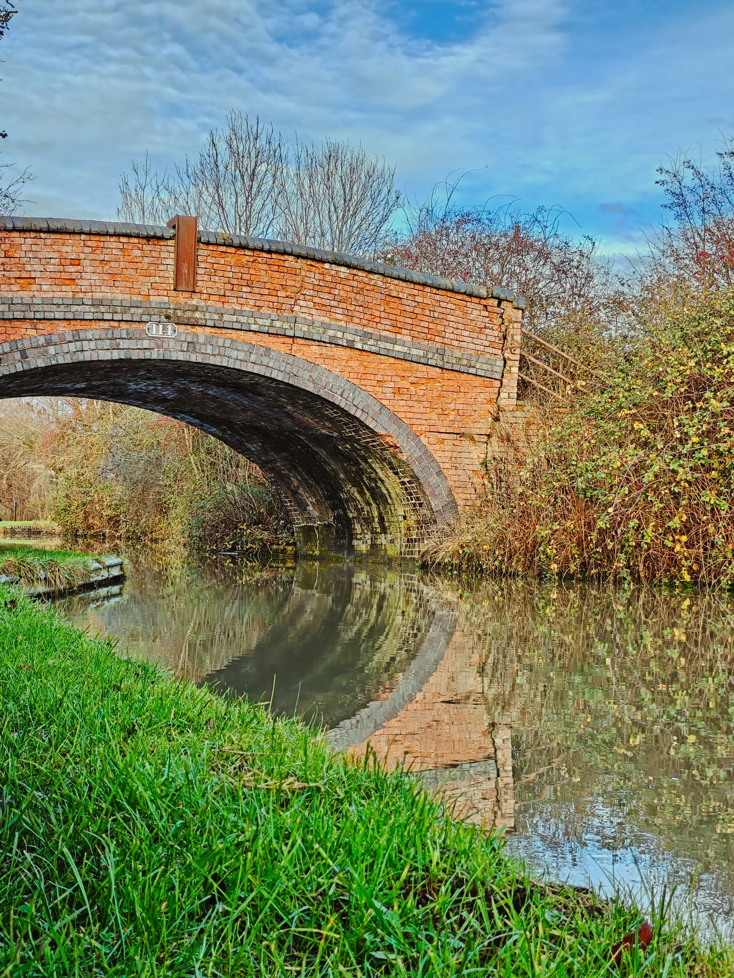 Grand Union Canal bridge reflection in water