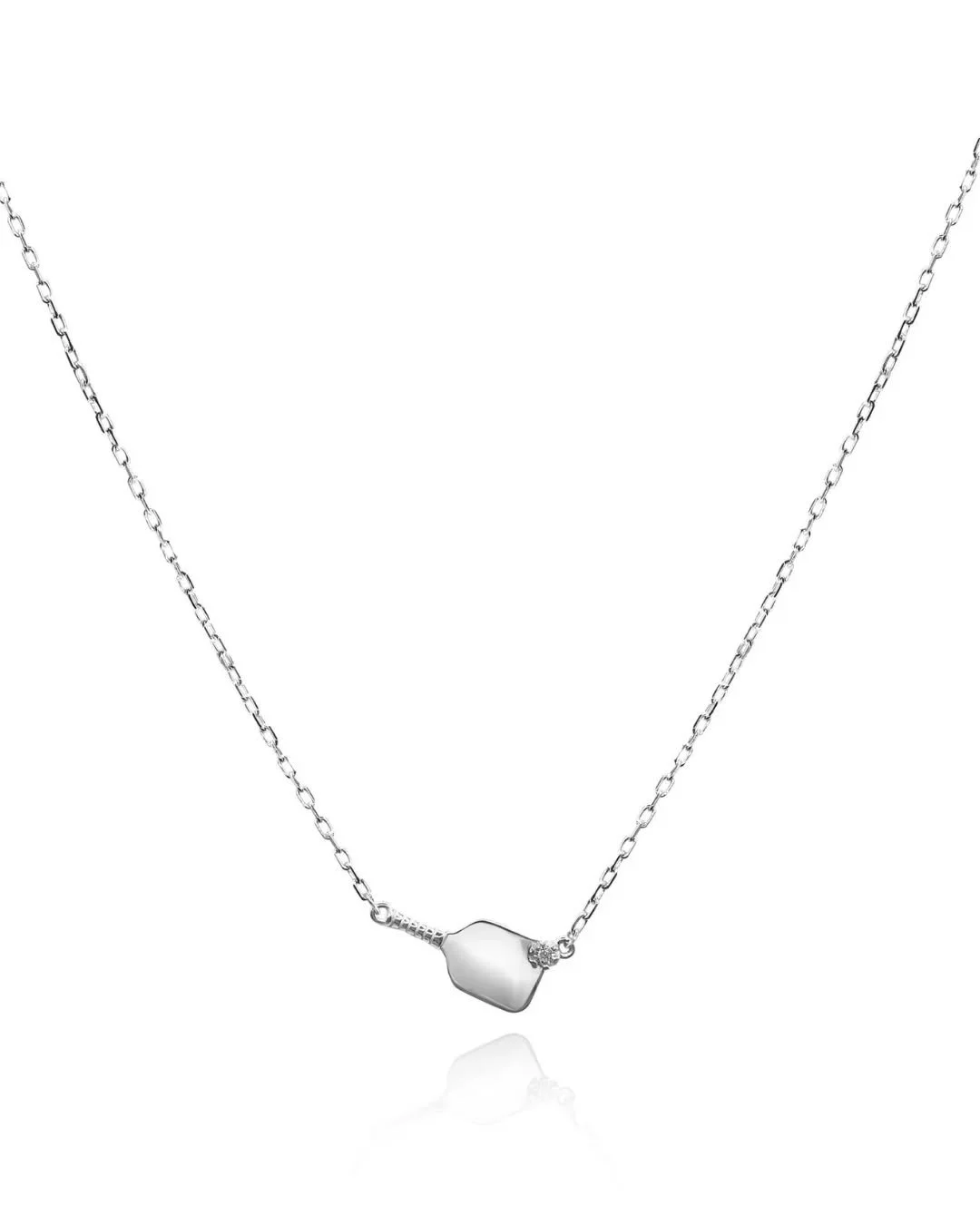 For lovers of the game...on and off the court.

Our Pickleball Necklace is handcrafted in NYC, set with a petite diamond, and finished on a modern paperclip chain.

✨ Available in sterling silver or 14K gold
✨ Handcrafted by women artisans
✨ Subtle s