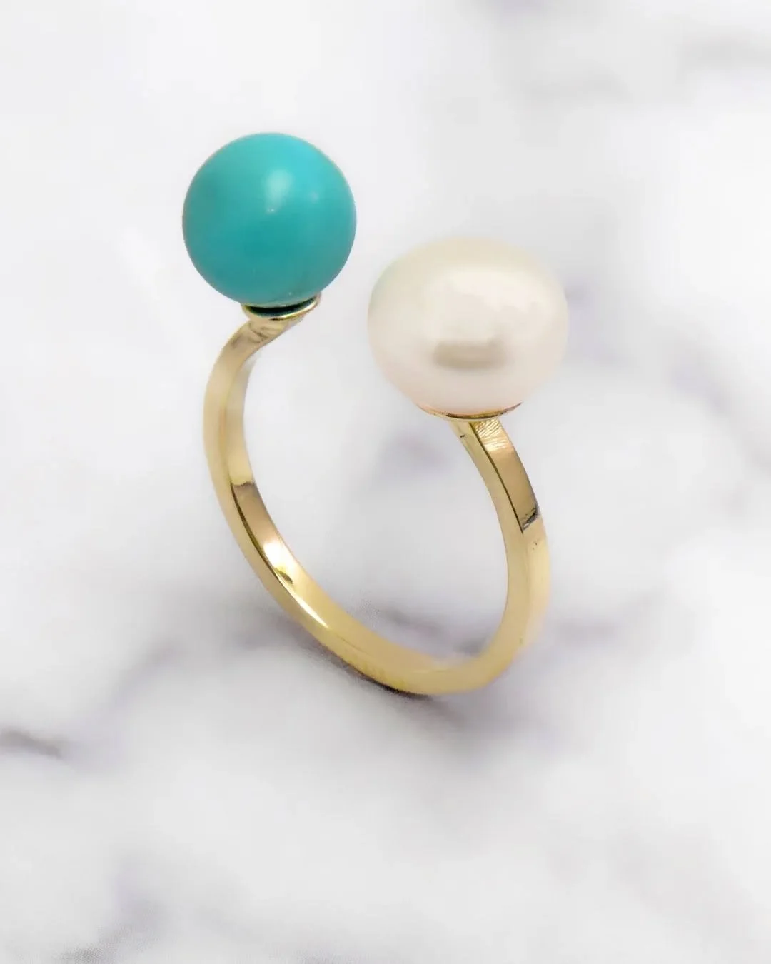 Turquoise meets pearl in a modern design. Yellow gold, vintage-inspired, completely timeless.

 #turquoiseandpearlring #nycjeweler #pearlsjewellery #vintageinspiredjewelry