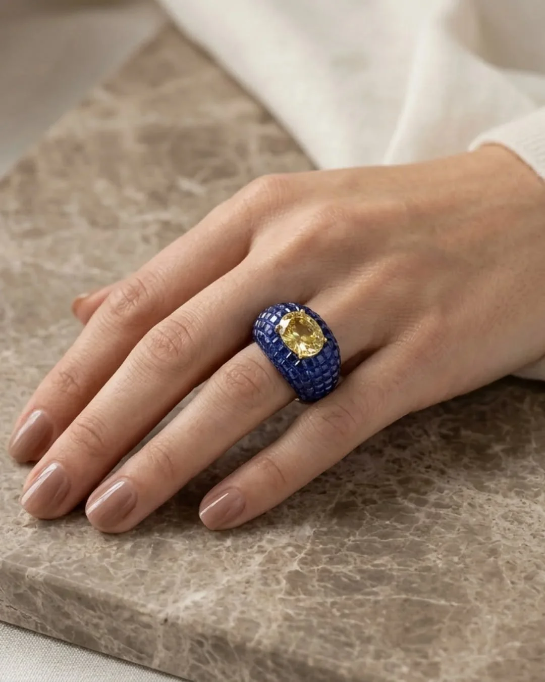 Invisibly set sapphires wrapping a vivid yellow diamond. 

#bespokejewelrydesign #customjewelrydesign #NYCJeweler #yellowdiamondring #bluesapphirestones