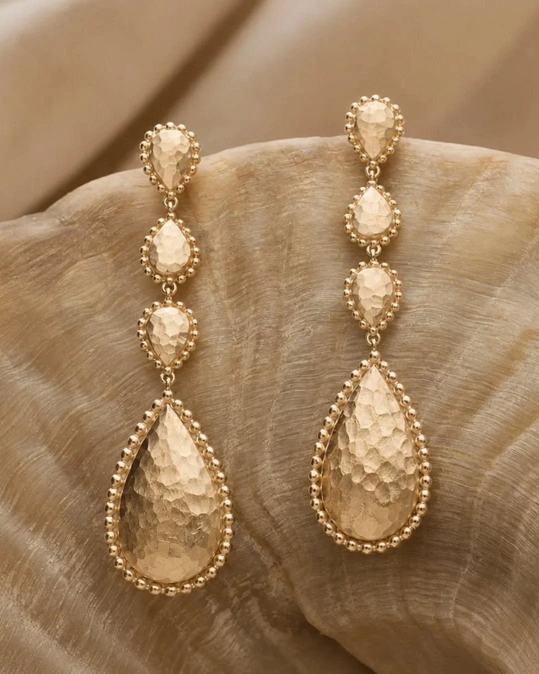 Not your grandmother&rsquo;s gold earrings. These hammered beauties catch the light with every movement&mdash;organic, sculptural, and unapologetically bold. A little bit ancient goddess, a little bit downtown cool.
Designed for the woman who wants h