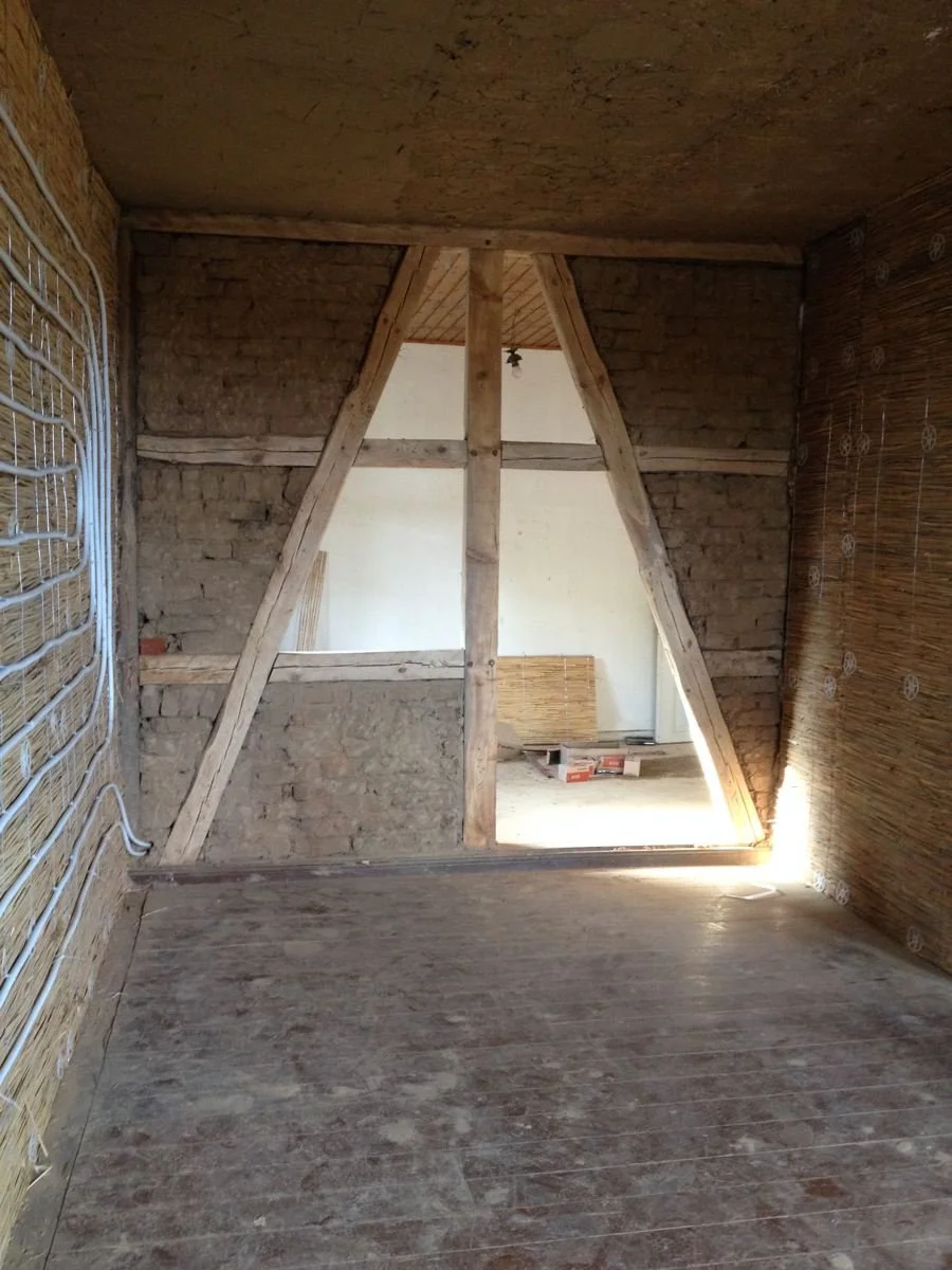 Straw bales provide r-30 insulation and walls can also be heated with pex pipes running hot water to radiate heat in a cold room