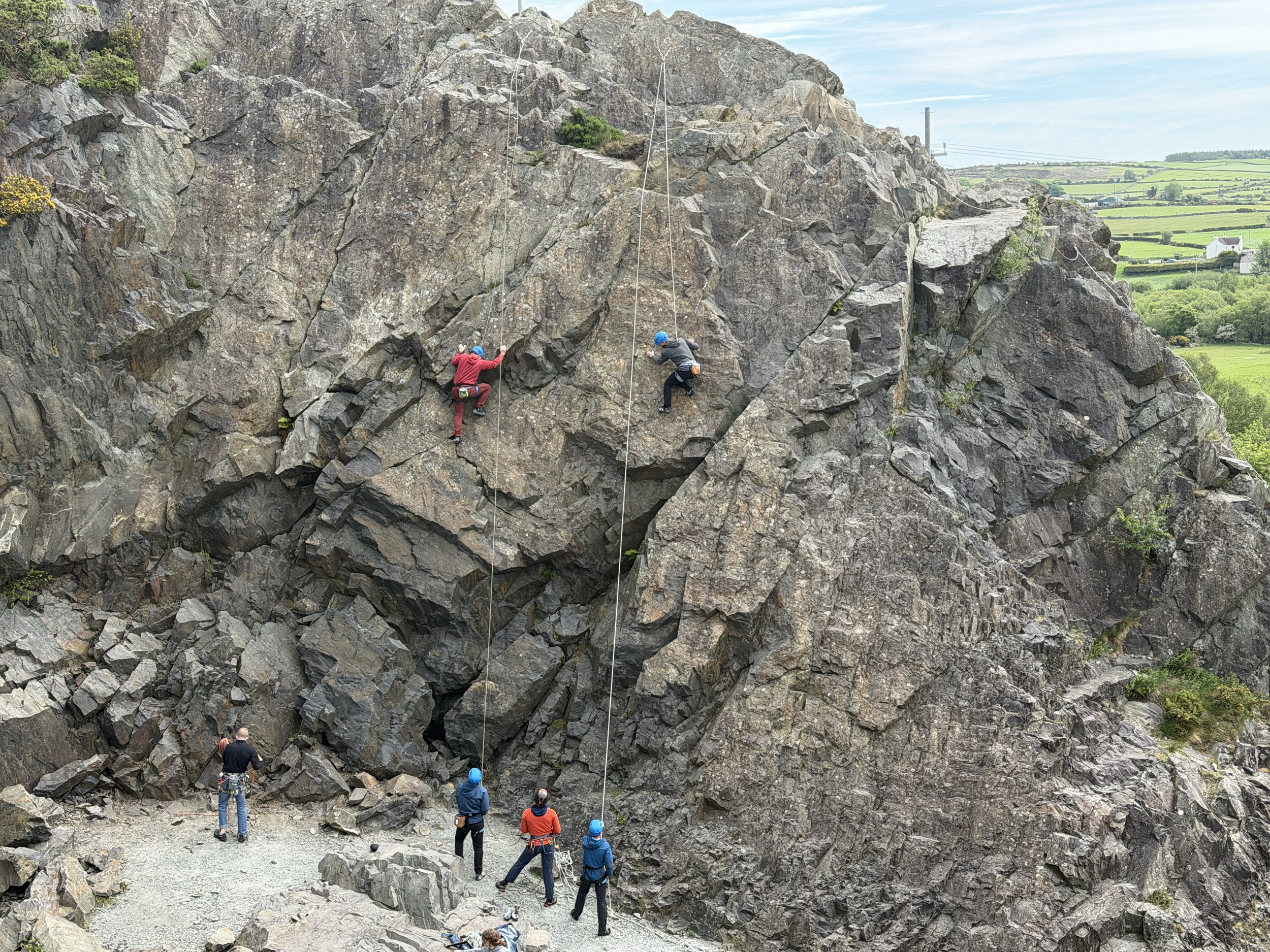 A climber climbing under instruction at Altnadue Quarry
