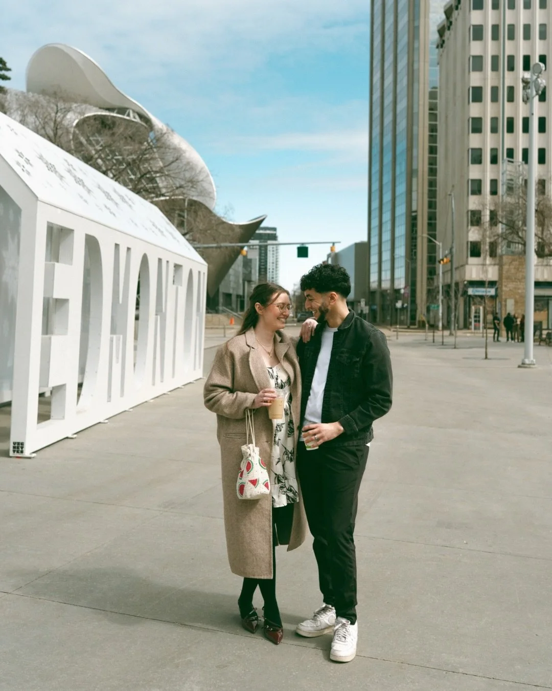 Kaitlyn and Walid are getting married in just a few weeks!! Last month I shot their engagement session at City Hall, and I suggested we begin by meeting at a local coffee shop (@rosewoodfoods) and walking over together. I mean, their first date was a