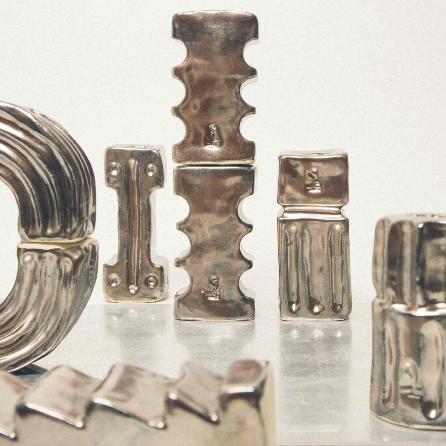 - Candle holders - ceramics dress as metal