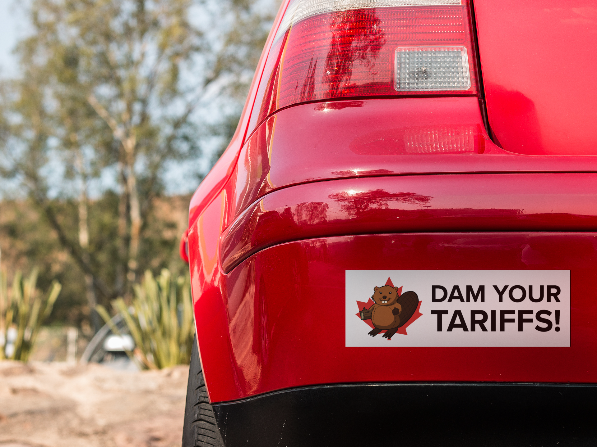 square-sticker-mockup-in-the-back-bumper-of-a-red-car-a15343.png
