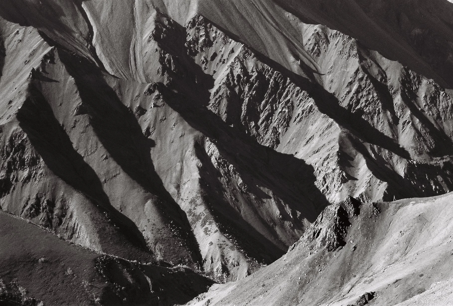 Black and white details of a mountain range in the Yukon.