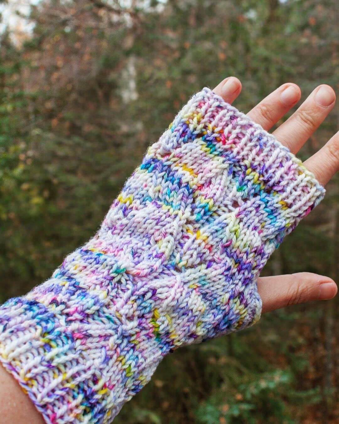 Meet Riverbed Fingerless Mitt! The faux cable pattern is inspired by the many winding rivers here in Alaska. 

These mitts are perfect for using up leftovers from other projects (knit in DK weight yarn) and while the pattern is written in one size, t