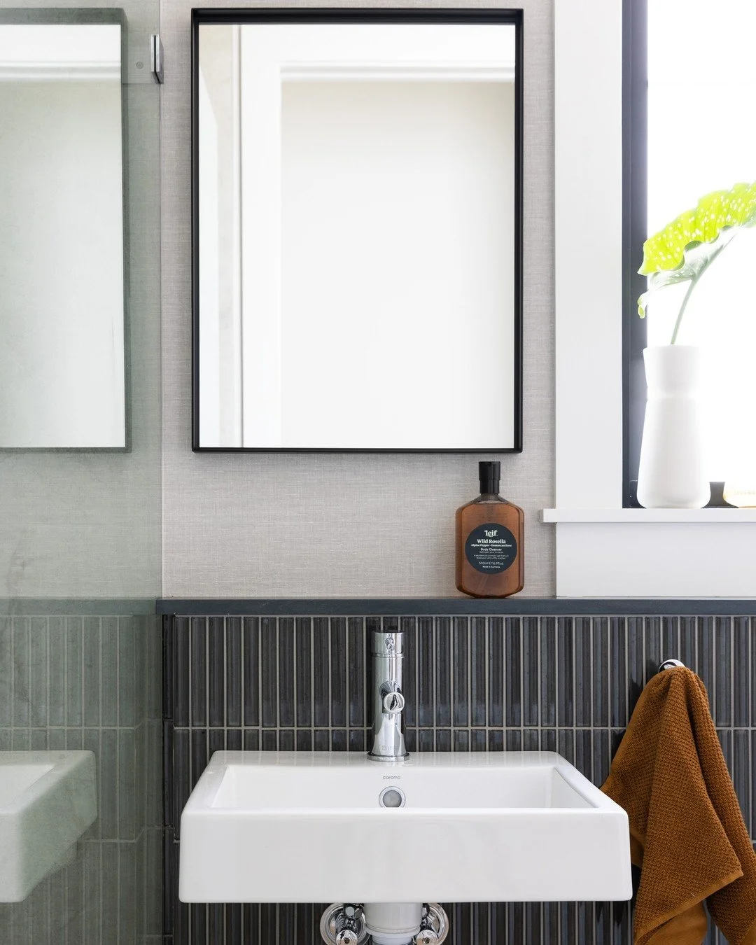 Timeless, classic and monochrome....the perfect vibe for the guest bathroom at our Gentleman's Retreat project. 

The charcoal tiles and black rimmed mirror softened by the neutral textured wallpaper we applied to the walls. 

Interior design by @ner