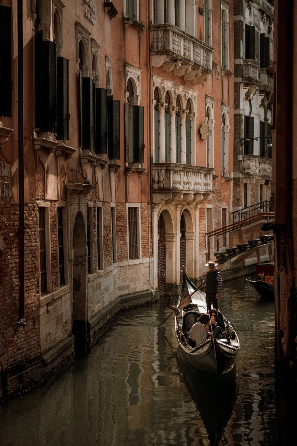Gondola Navigating Quiet Venetian Canal.jpg