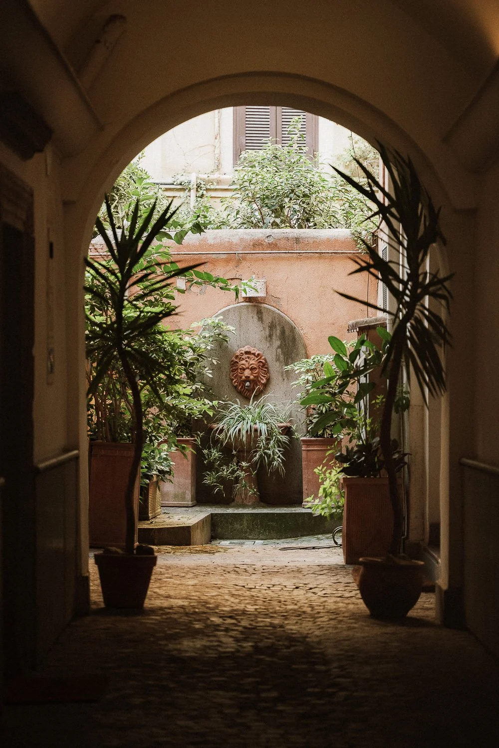 Courtyard Lion Fountain through Archway.jpg
