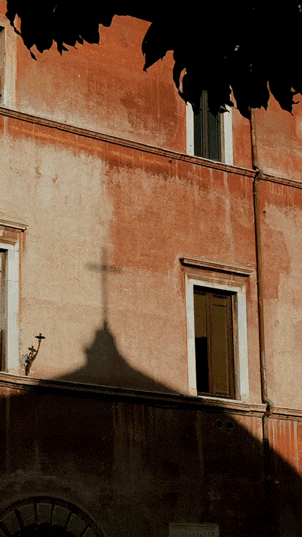 Roma-and-a-cross-shadow-on-the-wall.gif