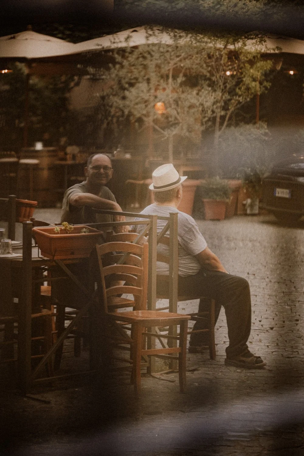 Two Men Seated at Outdoor Café.jpg