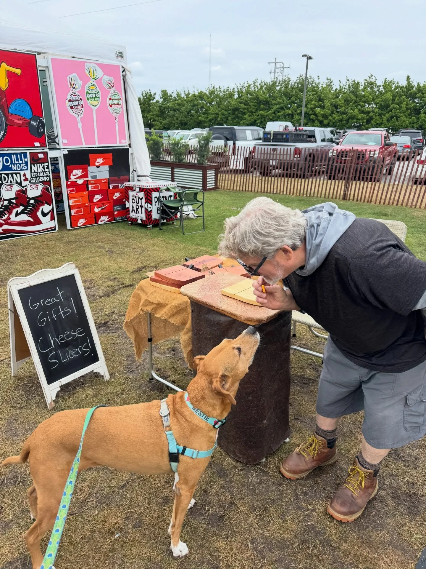 Someone made a new best friend, Tim Kuhlman (amazing wood crafted cheese boards) at ArtsQuest today. 😂🧀🐾