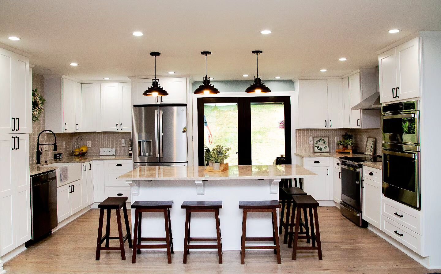 4! Can't believe it's almost the New Year! Remember how we renovated the farmhouse kitchen last spring?

We still love this transformation from a dark and small galley kitchen and dining room to one giant, cook's dream kitchen with ample space for st