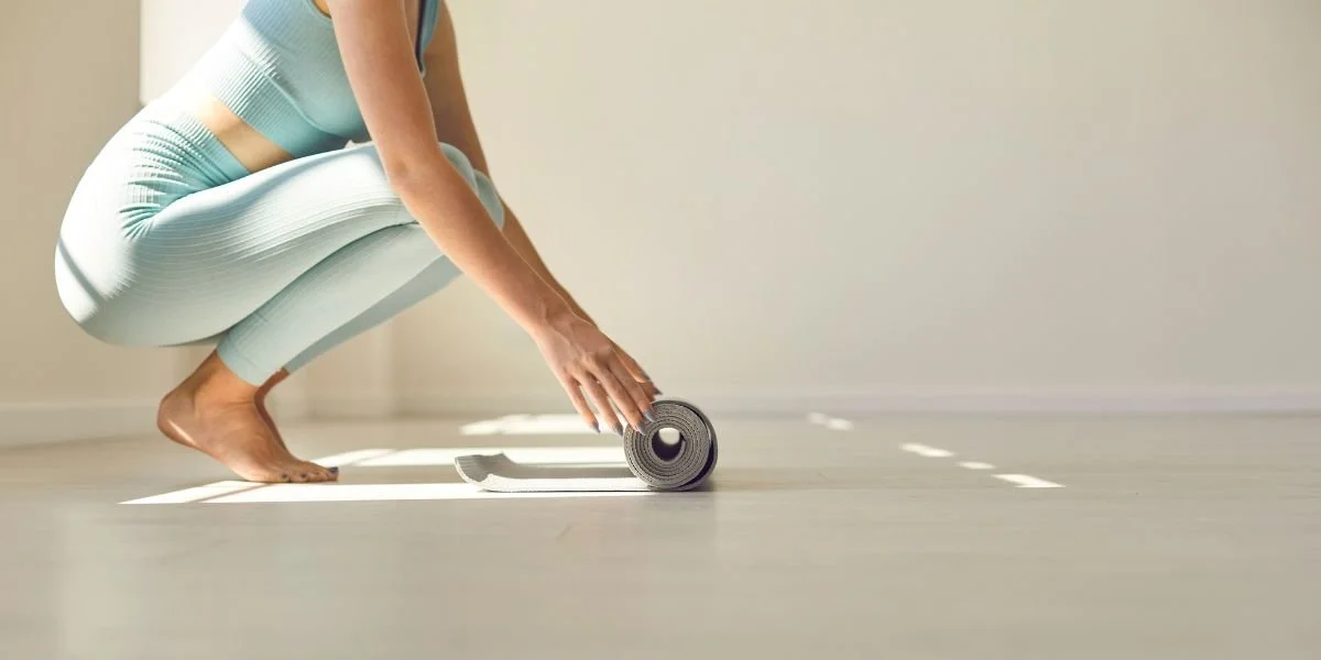 Woman with a Pilates mat Pilates Equipment for Home Use