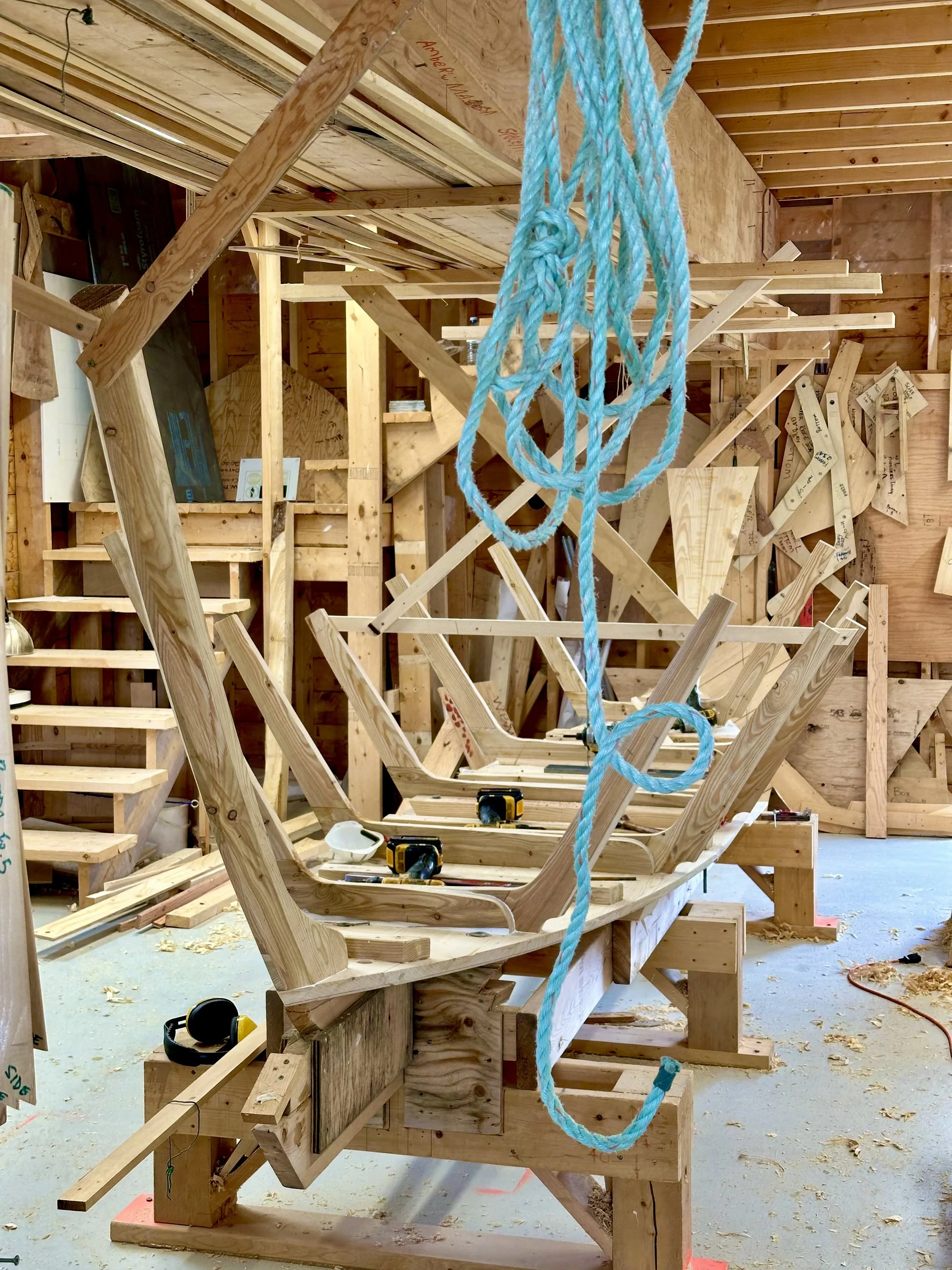 A dory with frame, stem and counter visible in the boat shed at the Wooden Boat Museum of Newfoundland and Labrador in Winterton.