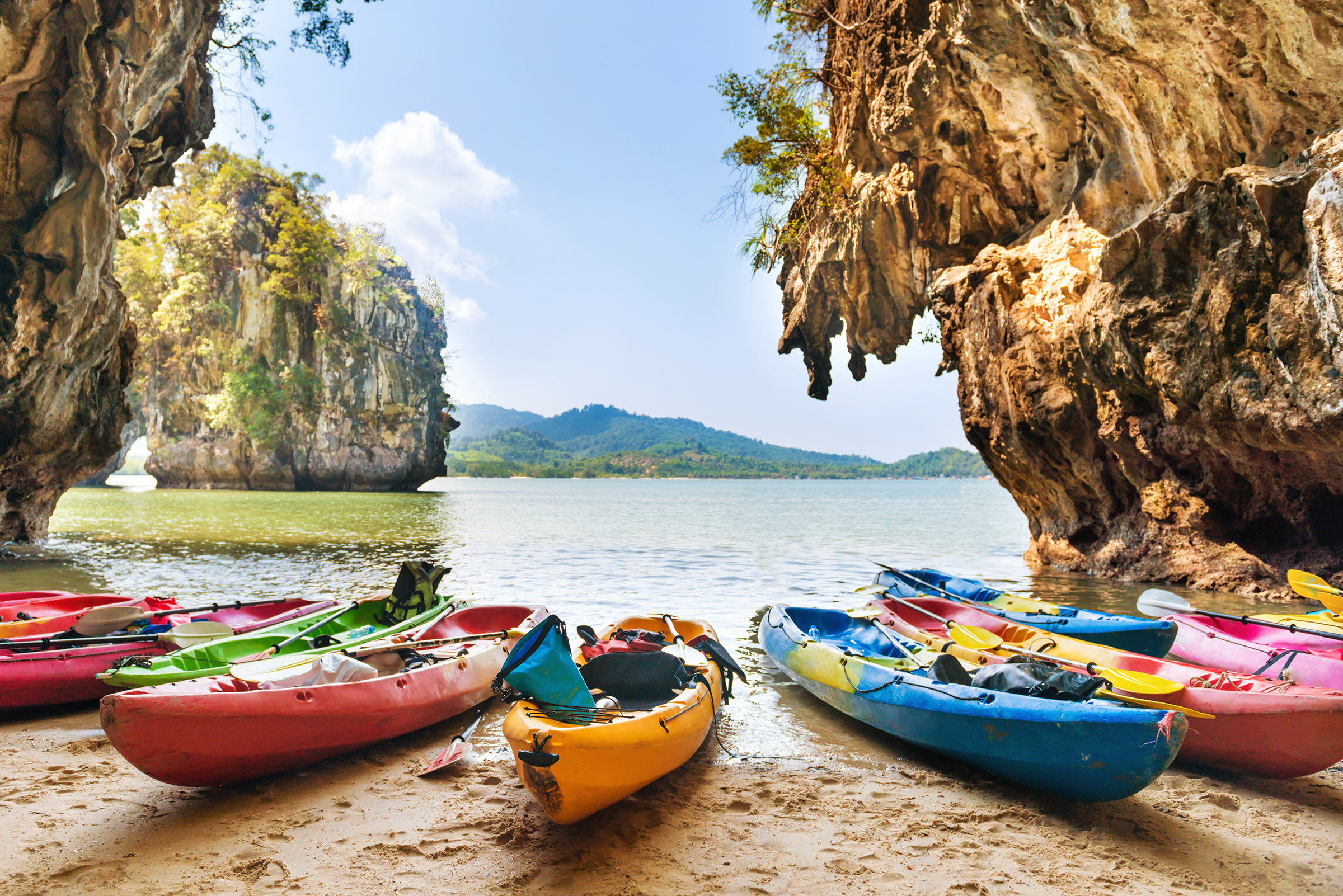 colorful-kayaks-moored-sand-beach-blue-sea-water-near-tropical-islands_2400.png