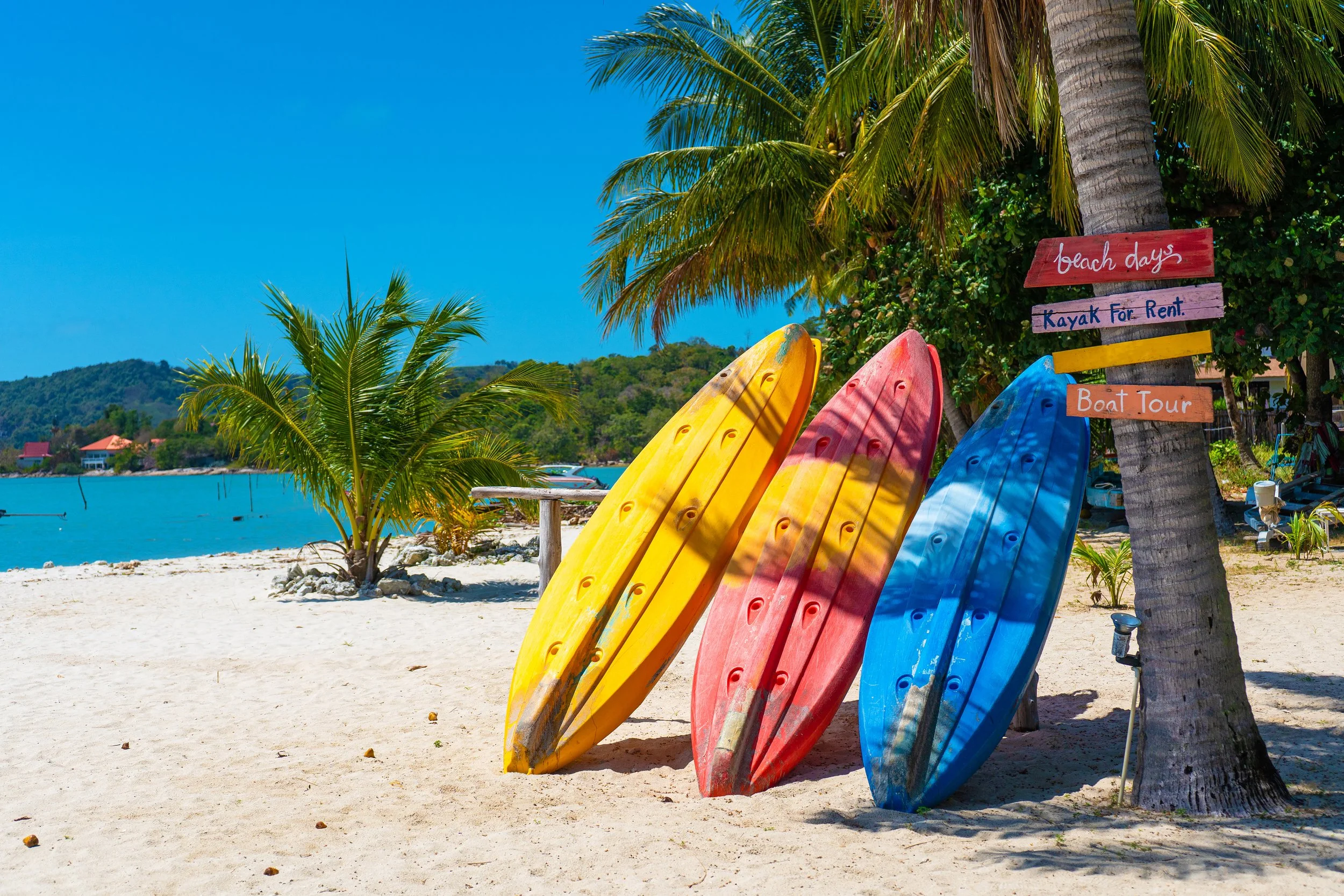 multi-colored-kayaks-tropical-sandy-beach-kayak-rental-tourist-entertainment2.jpg