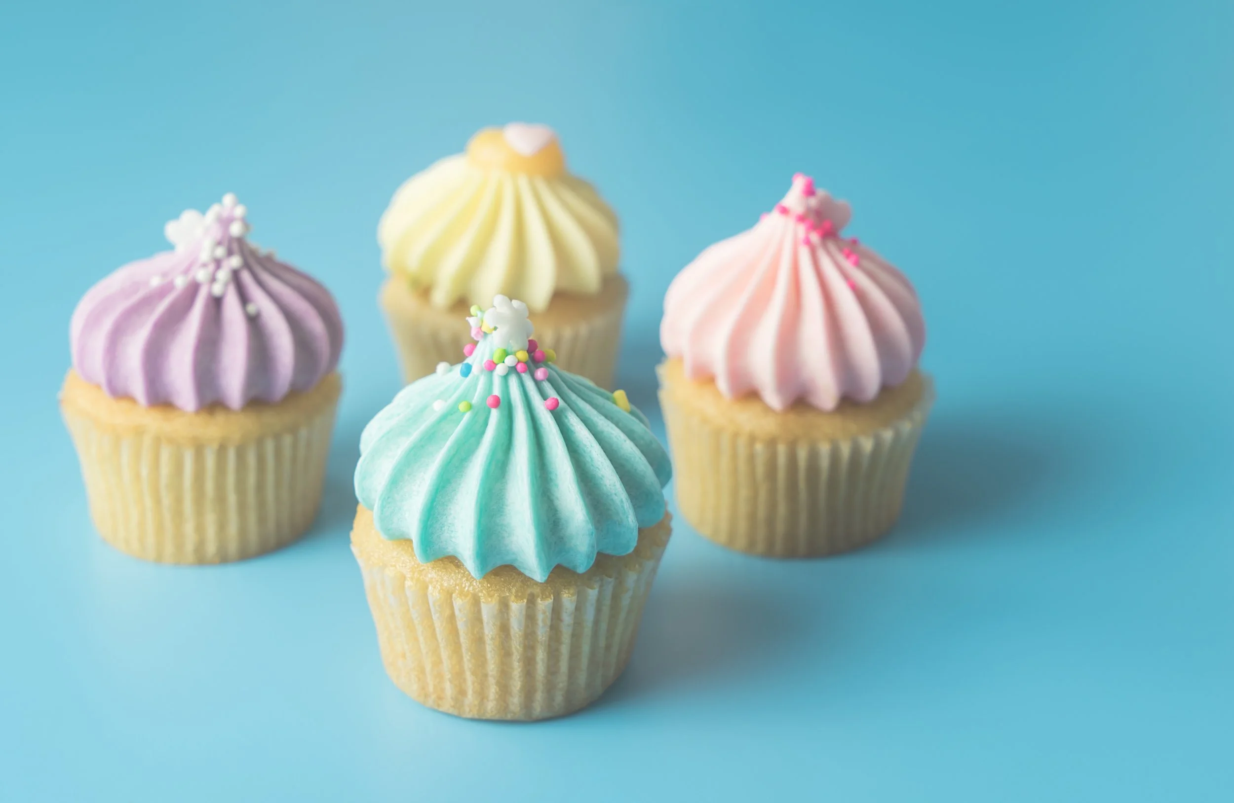 colorful-pastel-cupcake-blue-pastel-background-with-blue-cupcake-focus.jpg