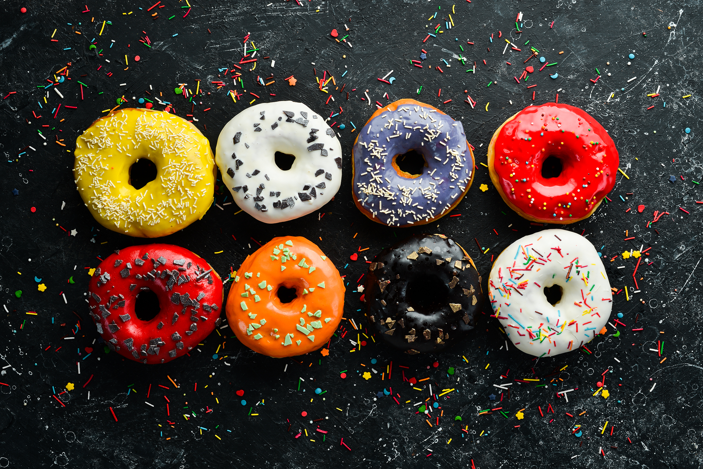 colored-sweet-baked-donuts-black-background-top-view-rustic-style_2400.png