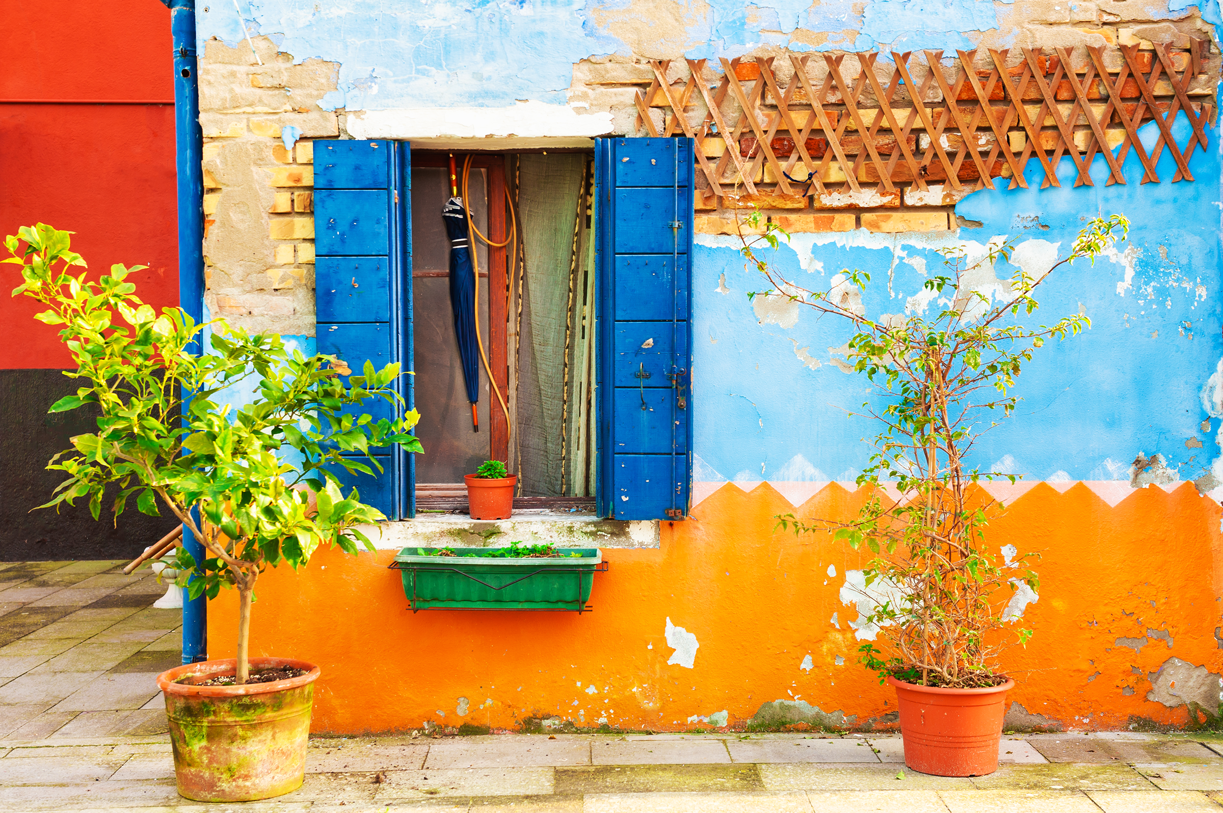 shabby-facade-house-window-with-blue-shutters-colorful-architecture-burano-island-venice-italy_2400.png