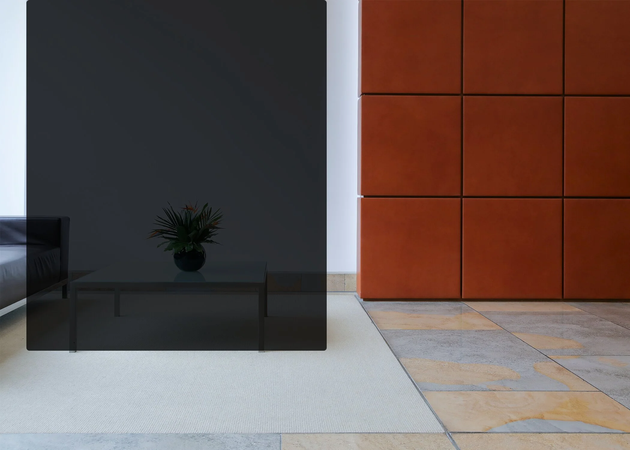 Building lobby with seating, a coffee table and tiled flooring
