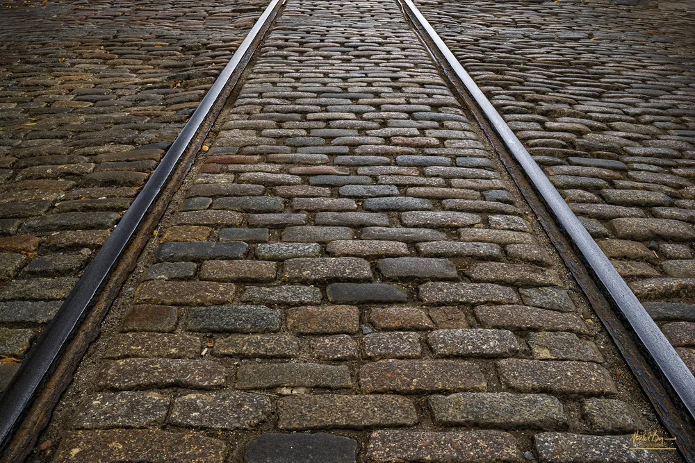 Tracked+Cobble+Stone+Street.webp