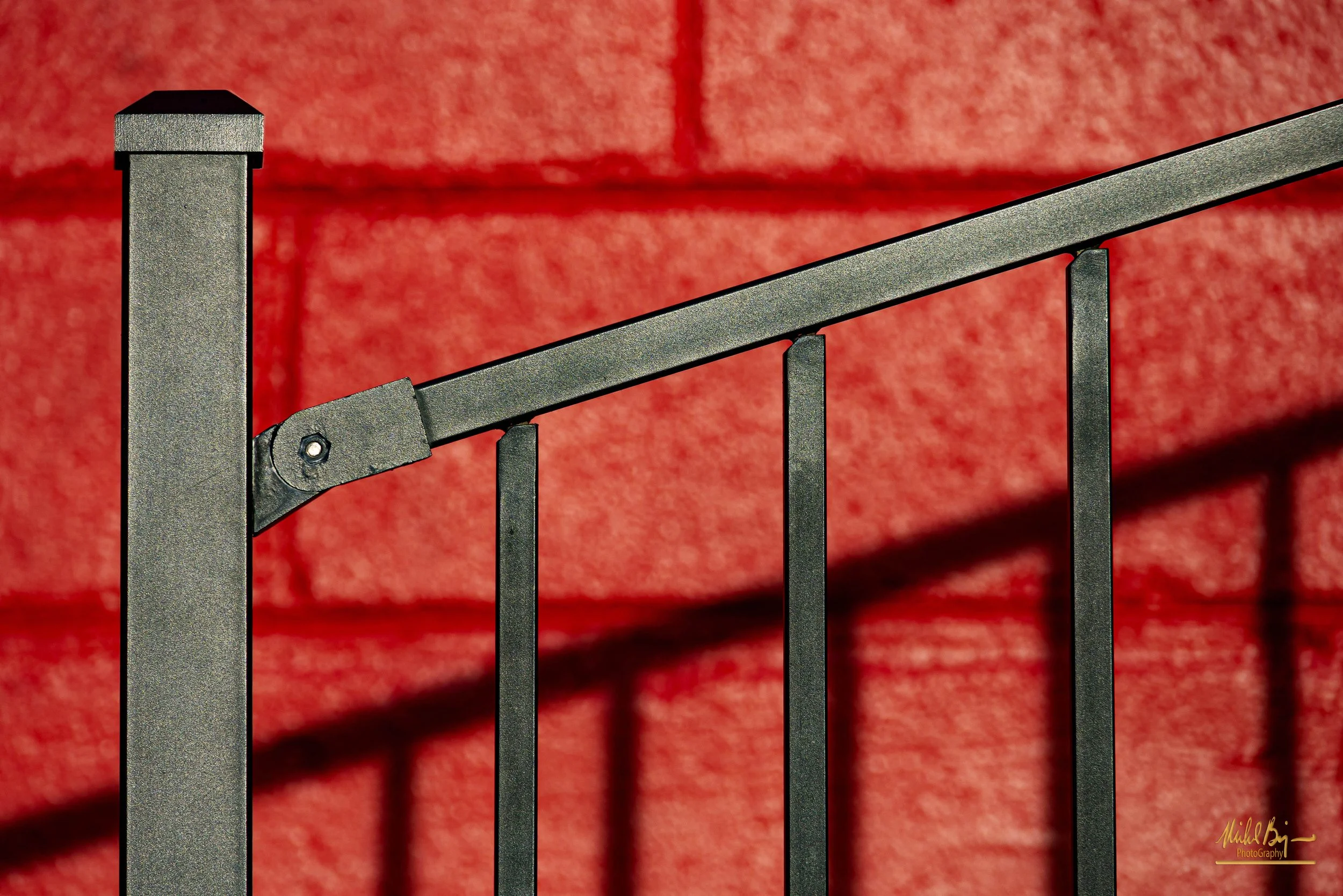 Fence on Red Wall.jpg
