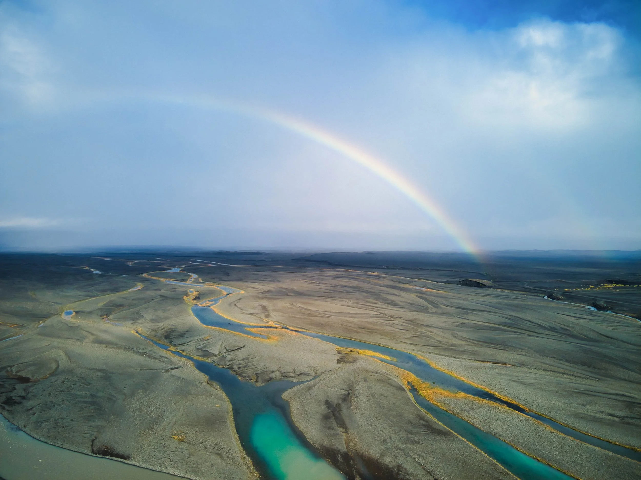 Rainbow over Icelandic terrain.