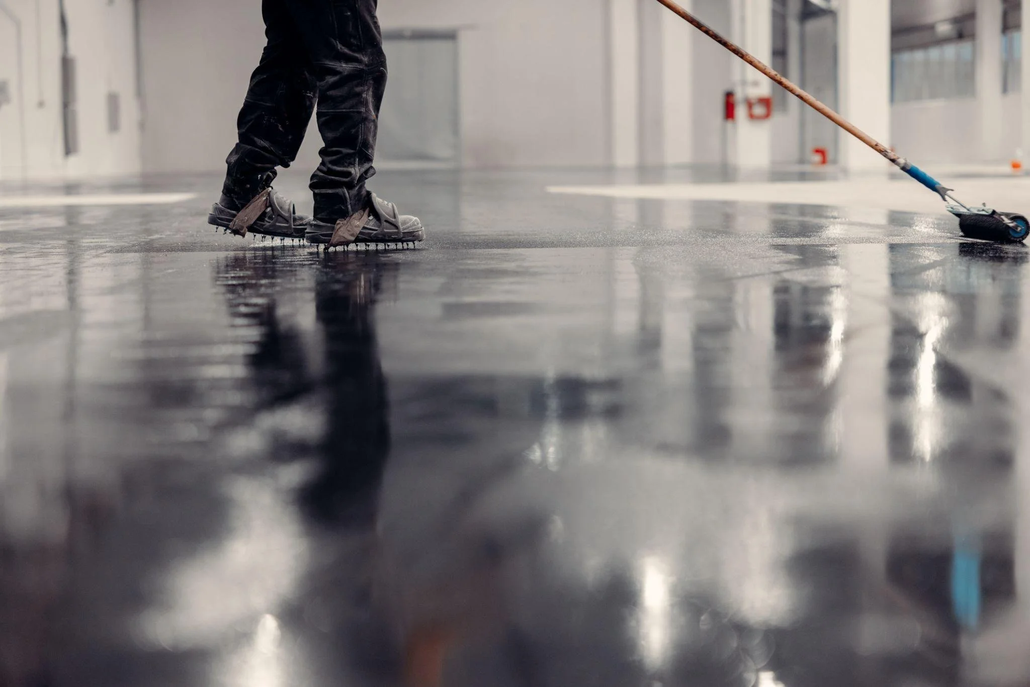 Speading Concrete floor finish in Portland OR