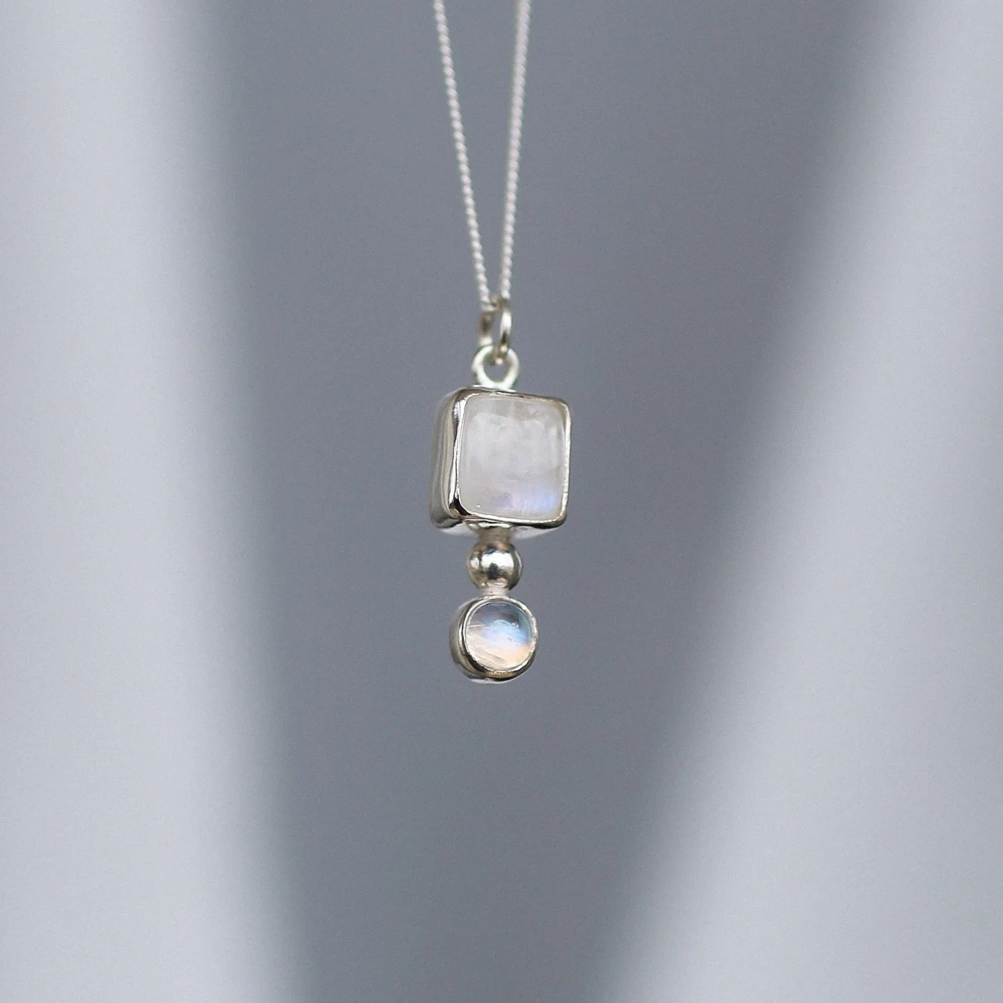 A stunning double moonstone pendant set in sterling silver&mdash;known for its connection to intuition, new beginnings, and emotional balance.🤍

Shop in person at @cafe_halcyon or online&mdash;link in bio.

.
.
.

#solmayjewelry #sterlingsilverjelwe