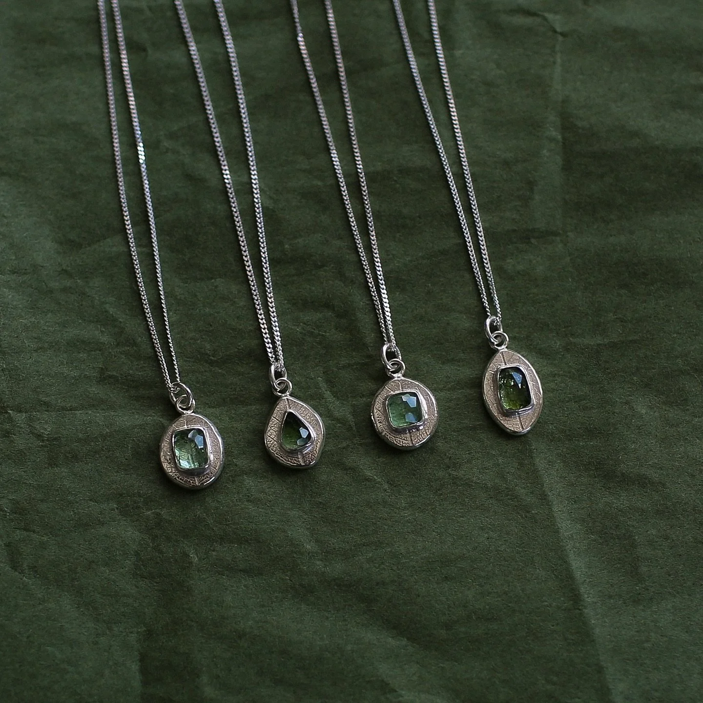 Soul pendants 🍃✨ ~ made by melting down recycled sterling silver and textured with a leaf imprint in the metal. Featuring gorgeous green tourmaline stones ~ each one is uniquely yours.

.
.
.

#soulpendants #solmayjewelry #sterlingsilver #pendants #