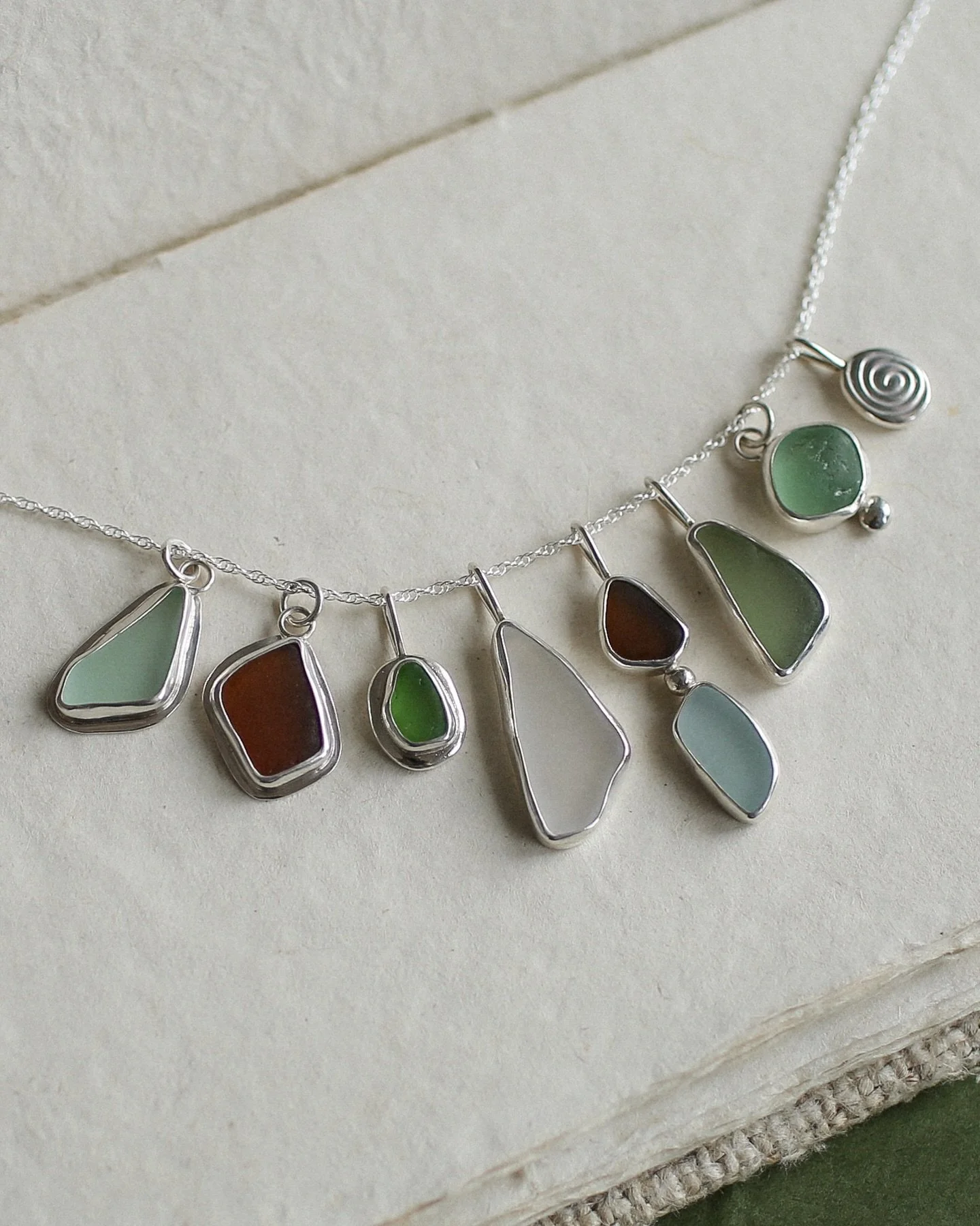 Seaglass pendants for the ocean lovers ⋆˚꩜｡ all seaglass found along Okinawa&rsquo;s coast and set in sterling silver ~ which one&rsquo;s calling to you? 🌊✨🌬️

.
.
.

#seaglassjewelry #silverjewelrylover #handmade #pendants #oceantreasures