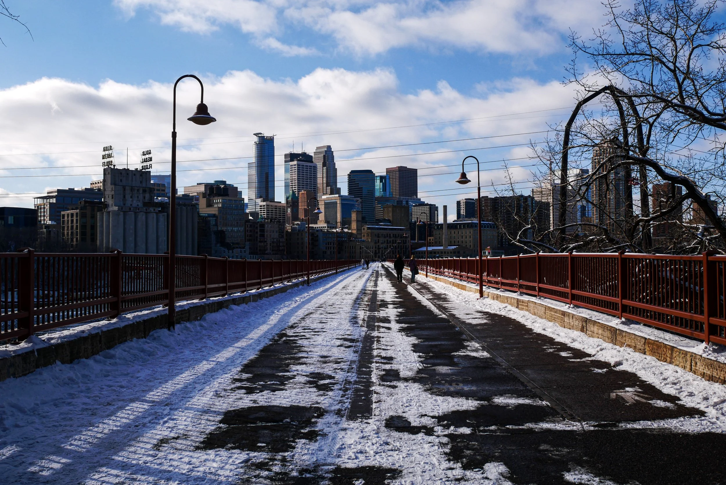 minneapolis minnesota skyline on stone arch bridge during winter