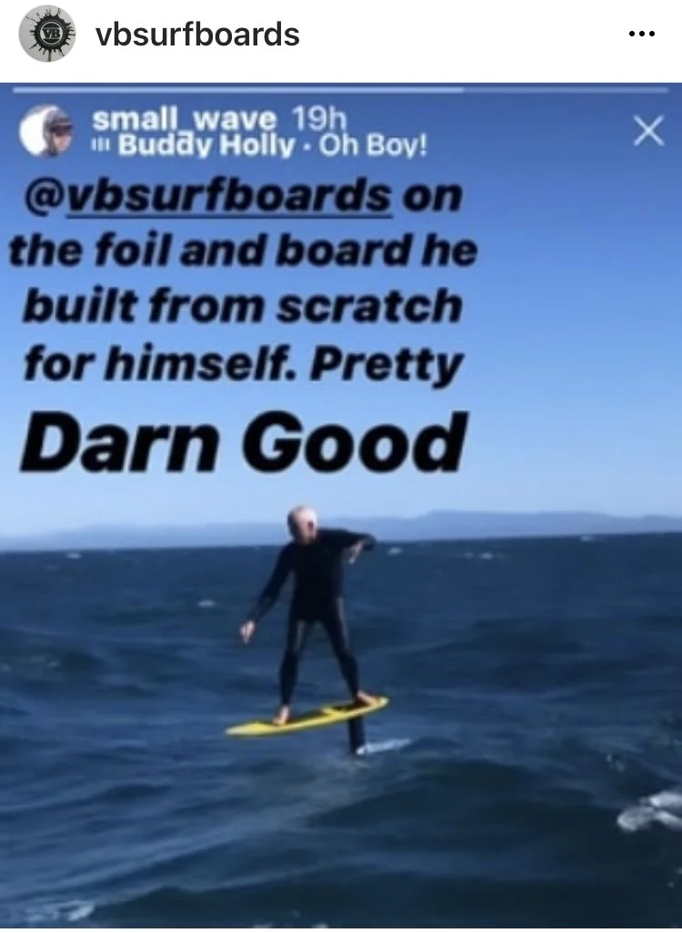 A person riding a foil surfboard on the water during the daytime.