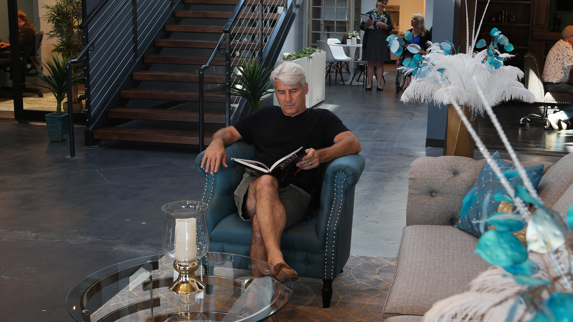 jim & reading book in Film Hub lobby.png