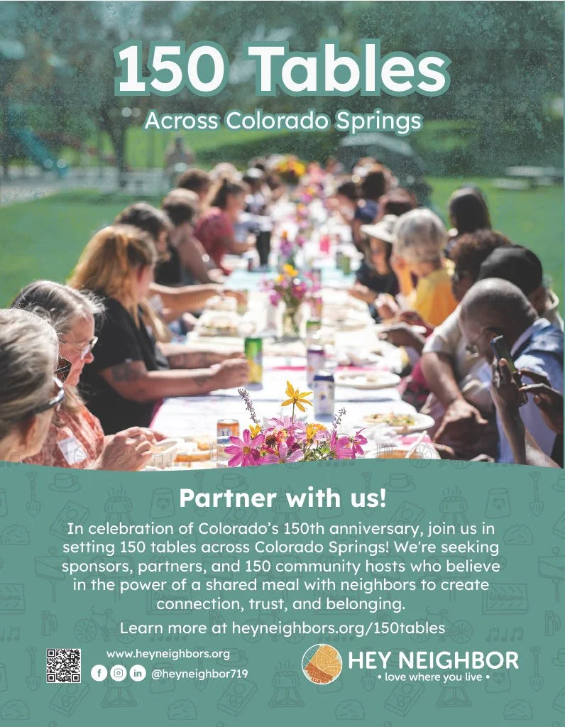 Neighbors sharing a meal together at a long table