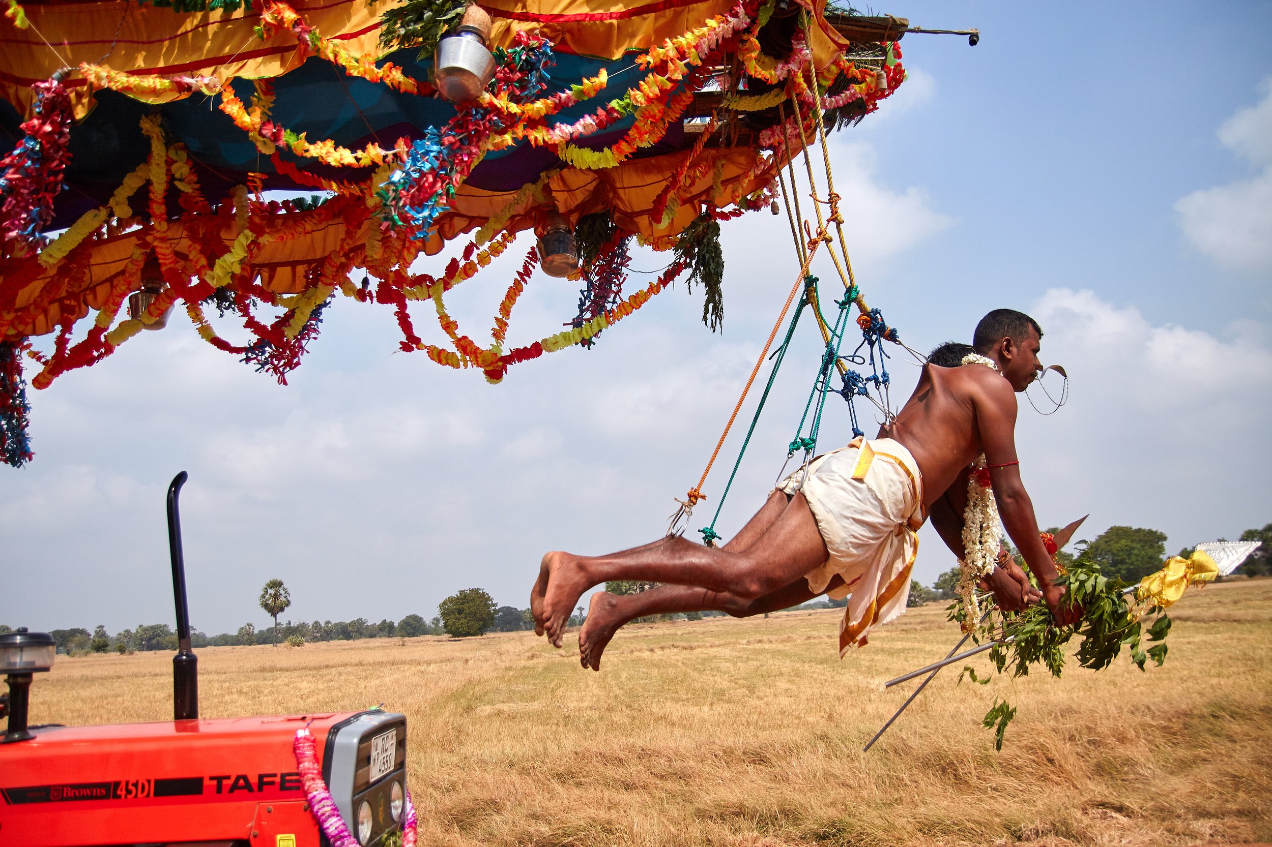 'Thookku Kaavadi' is one of the most extreme levels of Hindu worship. Usually, this is part of the wish for better luck and blessing from the higher power. Multiple hooks pierce through the skin, and the devotees hang from a larger platform which is 