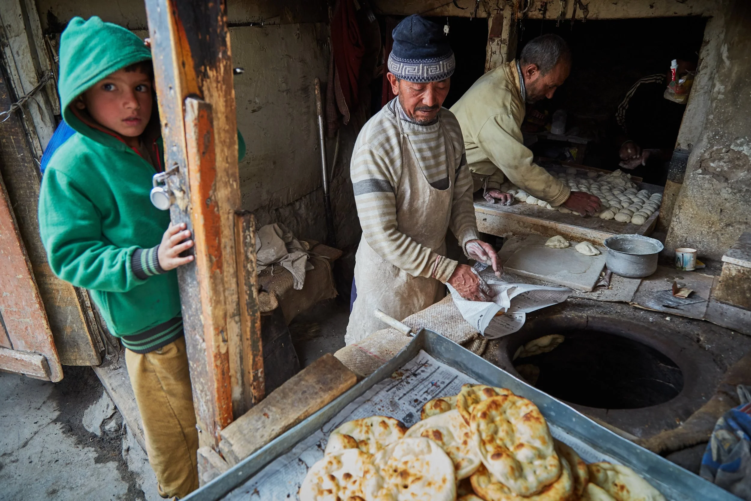 A local bakery is busy making fresh naan rottis in Leh. Buyers and sellers from outlying regions visit Leh for major shopping seasons, mainly before the winter hits. 