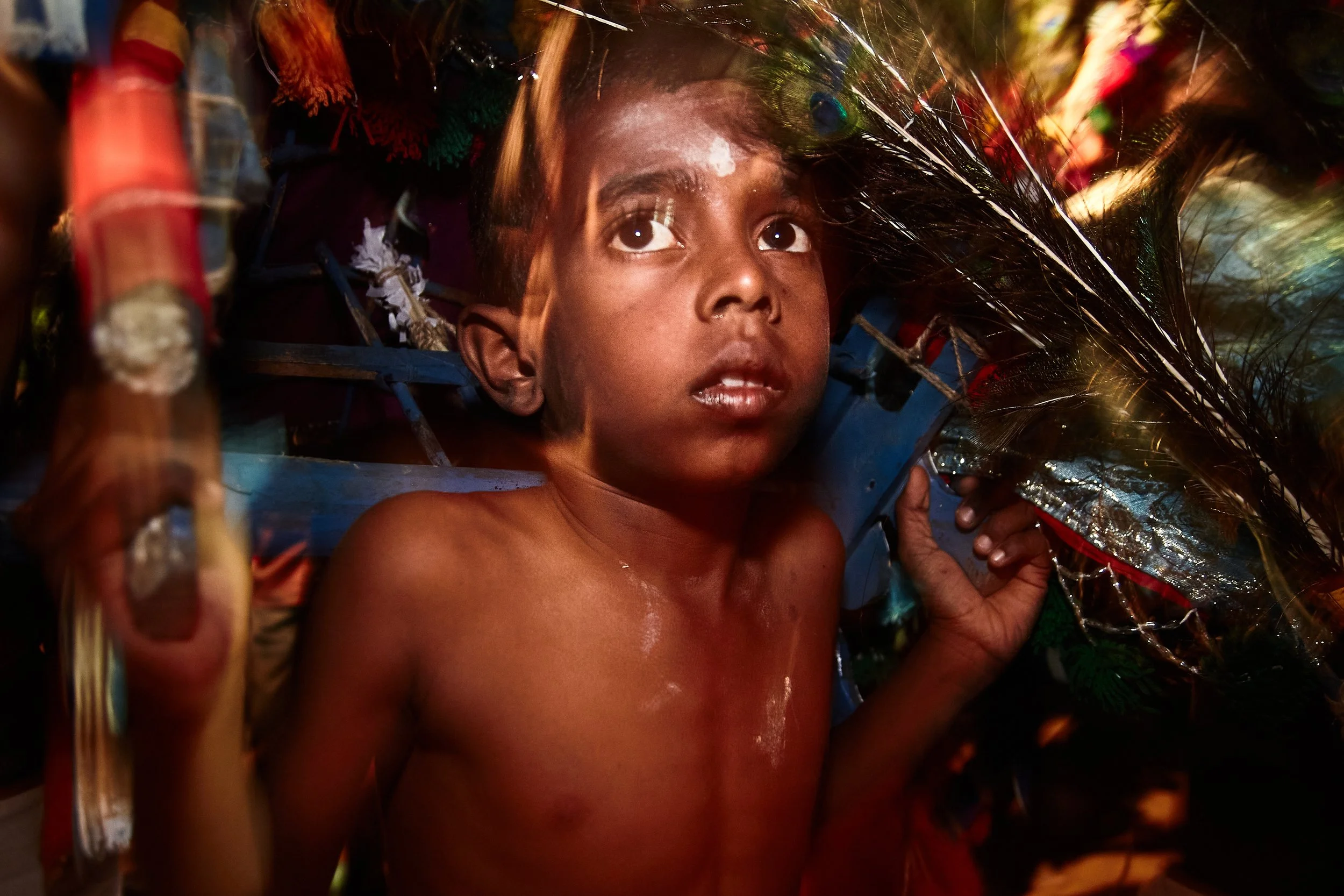 A young Kavadi dancer at the festival. Several thousand children died during the decades-long civil war in Sri Lanka, and many surviving children still live in orphanages.