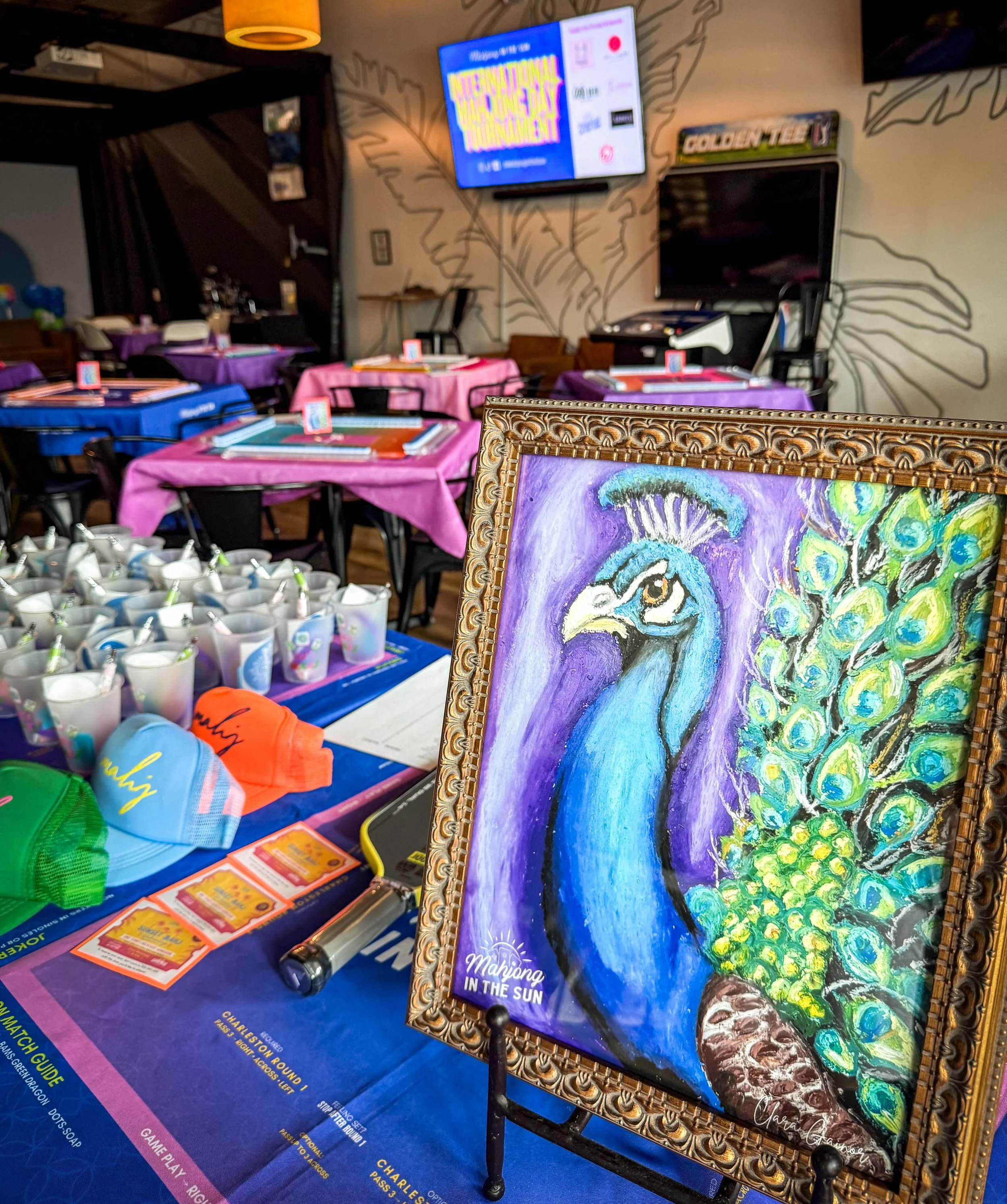 Happy International Mahjong Day! We are setup @reallygoodbeerstopnocatee and ready for our Inaugural Mahjong Tournament! Soon 32 Mahj lovers will fill this room to determine the @mahjonginthesun Champion! 

Peacock painting created by the talented Cl