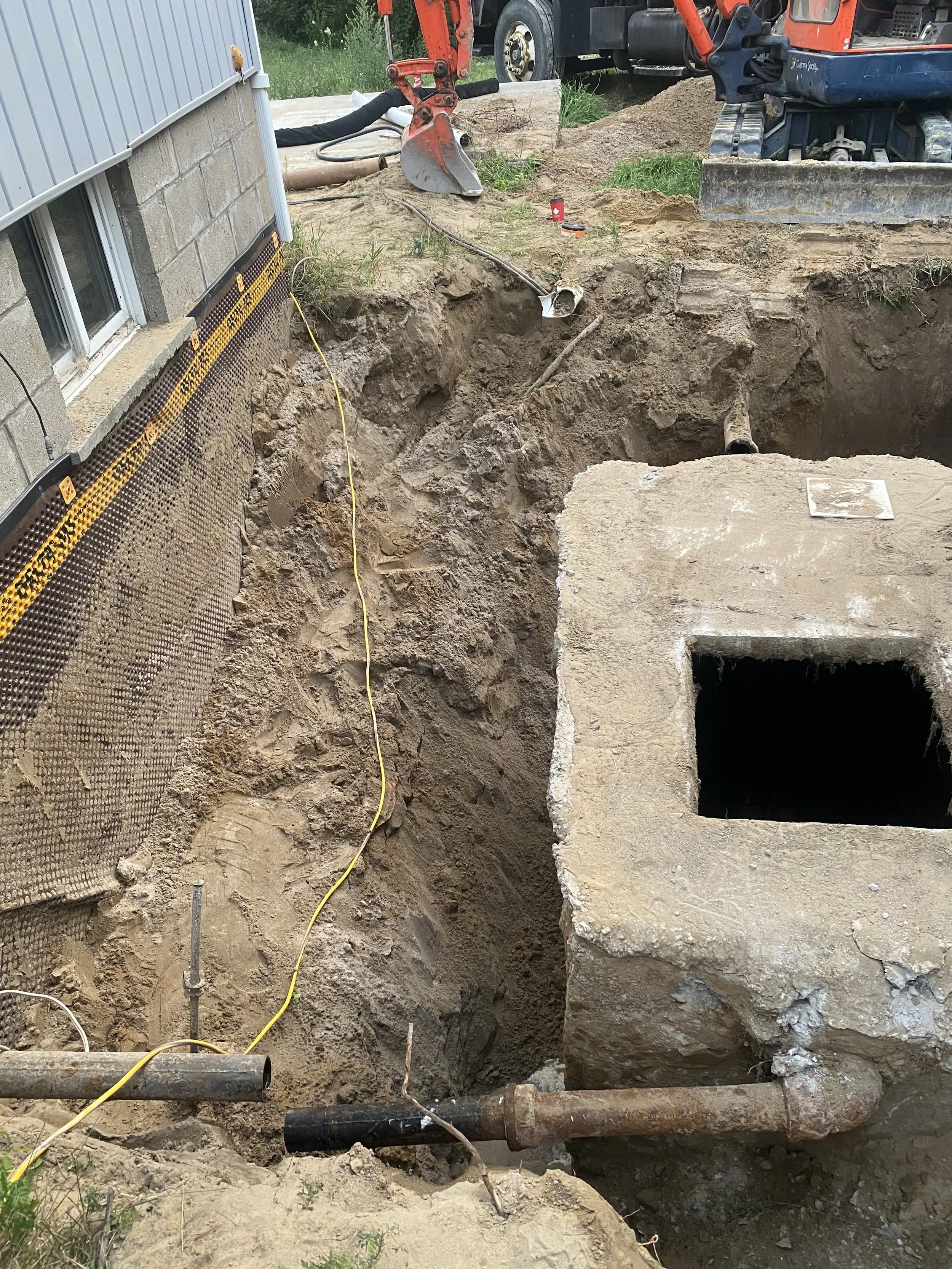 Licensed septic contractor removing old septic tank during system replacement in York Region Ontario